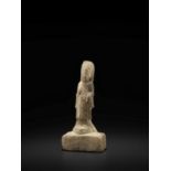 A RARE YELLOW MARBLE FIGURE OF AVALOKITESHVARA, NORTHERN QI DYNASTY