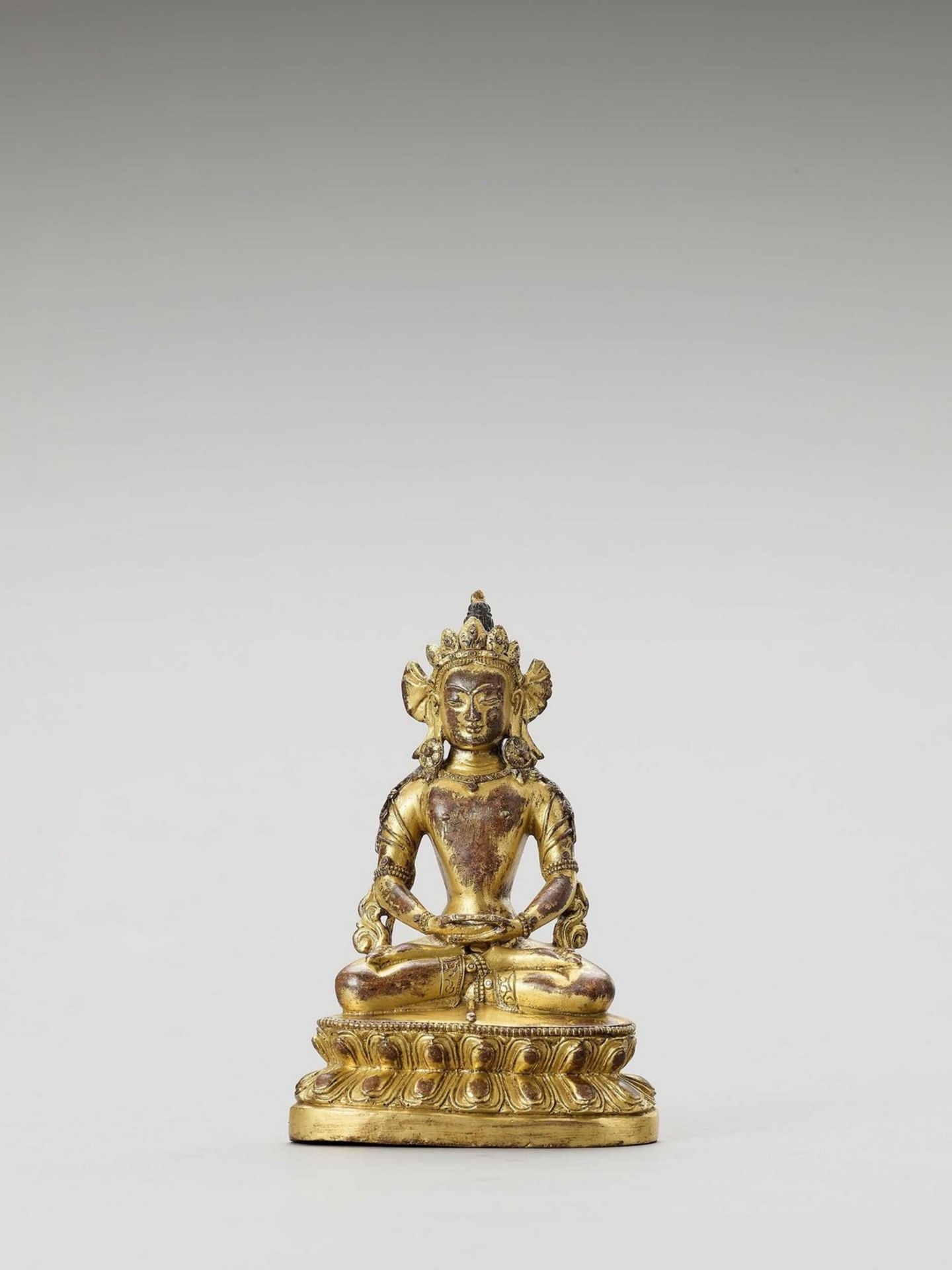 A SINO-TIBETAN GILT BRONZE FIGURE OF AMITAYUS, QING