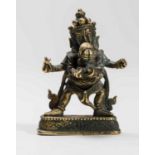 A TIBETAN BRONZE OF A DHARMAPALA IN YABYUM WITH PRAJNA