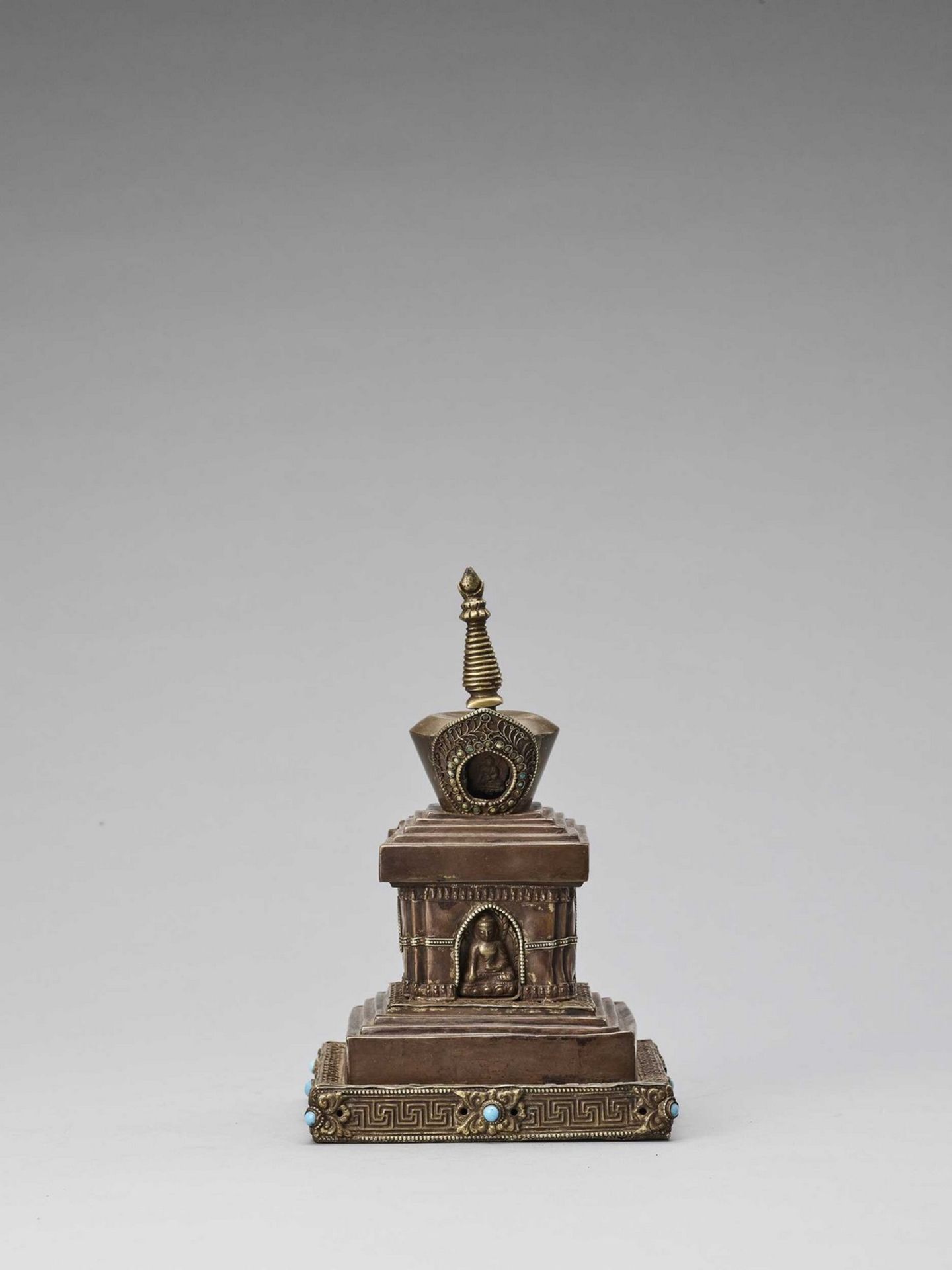 A TIBETAN COPPER REPOUSSÉ STUPA WITH TURQUOISES, 19TH CENTURY - Image 5 of 6