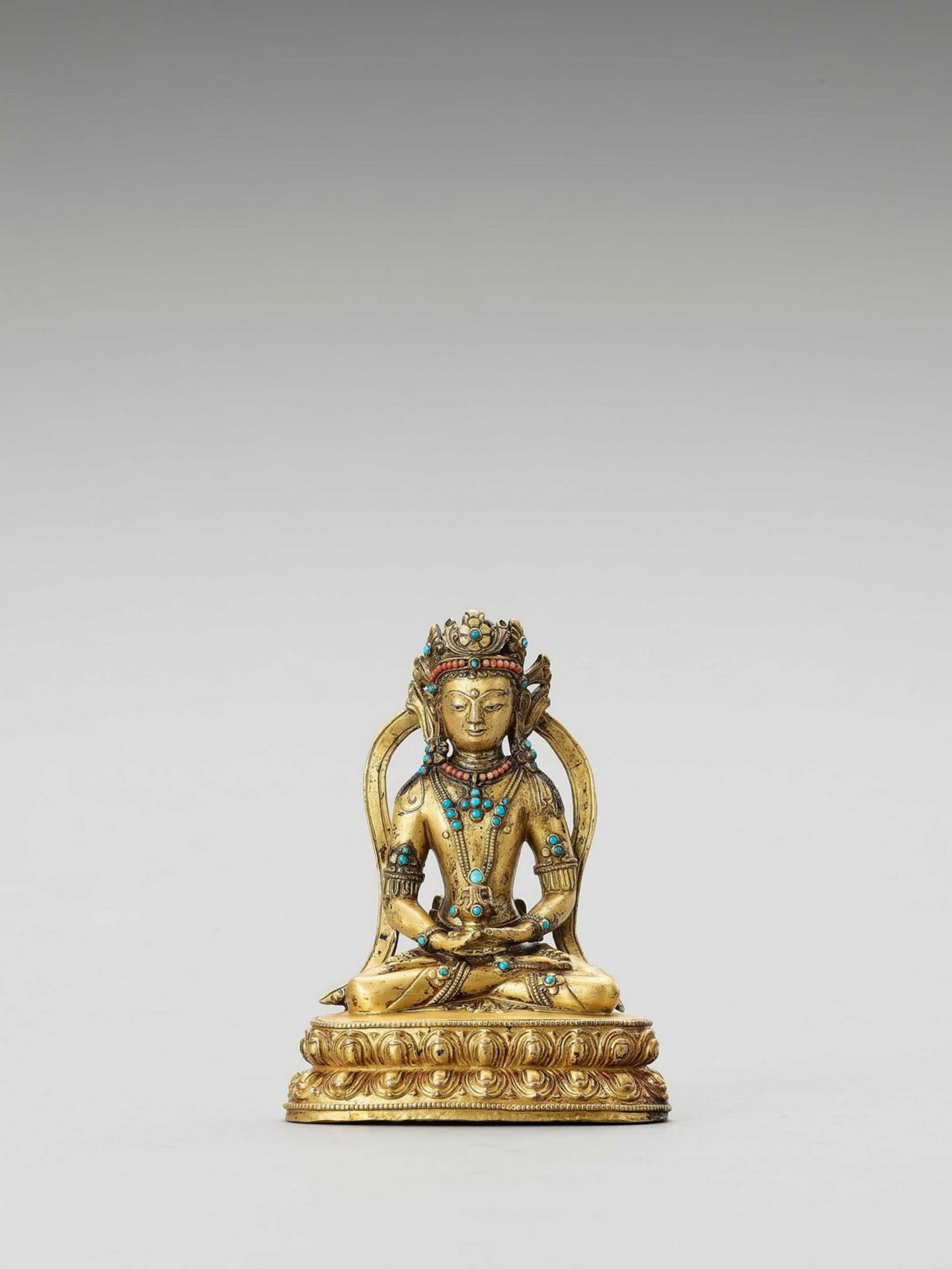 A SINO-TIBETAN GILT BRONZE FIGURE OF AMITAYUS, QING