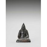 A TIBETAN HARDWOOD FIGURE OF TSONGKHAPA