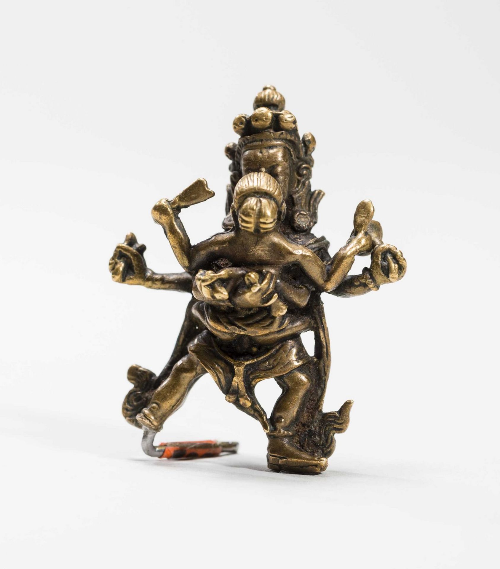 A TIBETAN BRONZE OF A DHARMAPALA IN YABYUM WITH PRAJNA, 18TH-19TH CENTURY