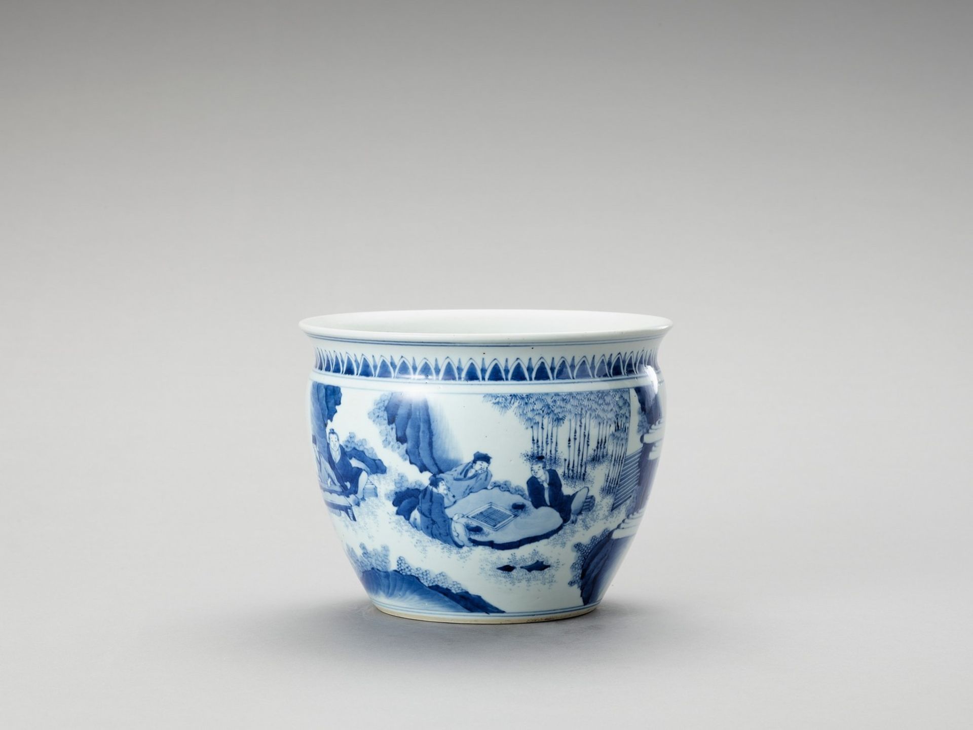 A FIGURATIVE BLUE AND WHITE PORCELAIN JARDINIERE