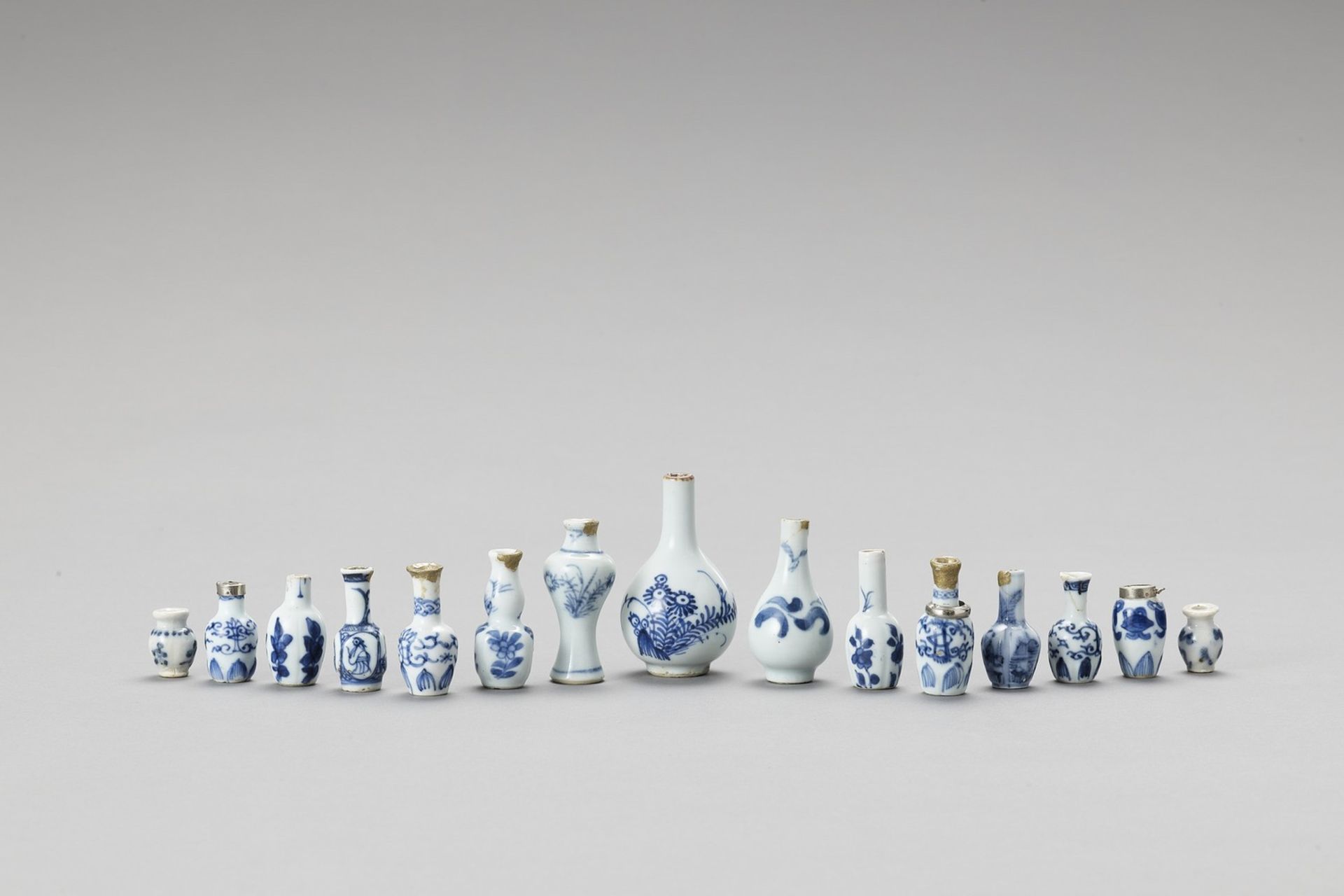 FIFTEEN MINIATURE BLUE AND WHITE PORCELAIN BOTTLE VASES