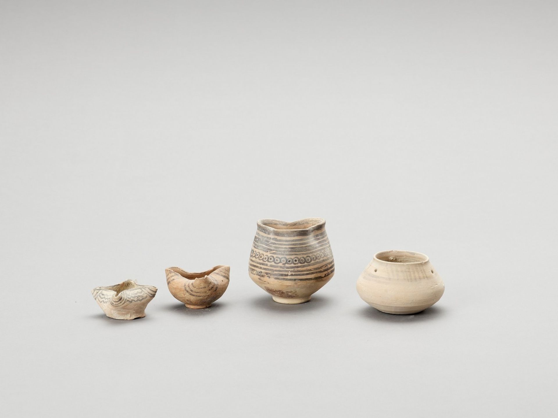 FOUR ANTIQUE CERAMIC OIL LAMPS FROM INDUS VALLEY