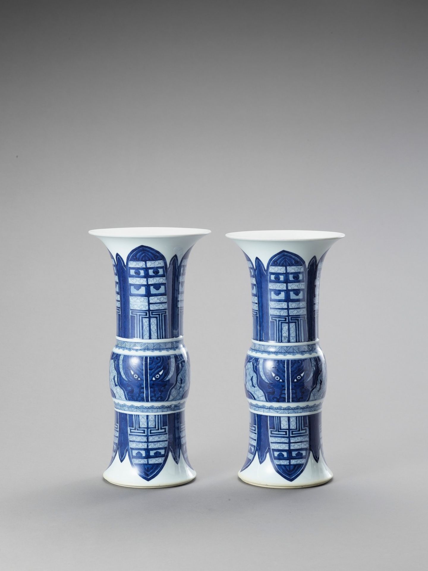 A LARGE PAIR OF BEAKER VASES