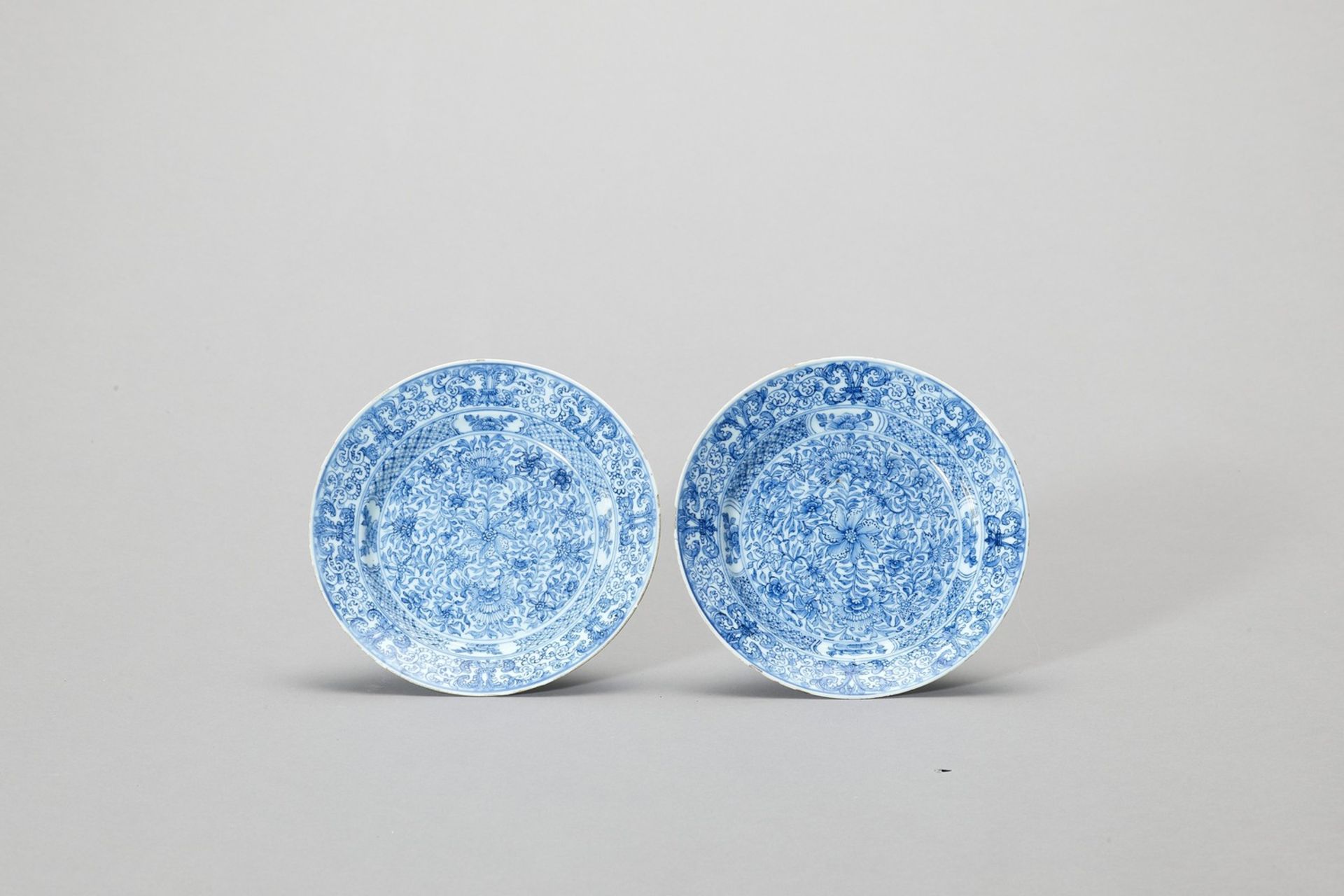 A PAIR OF ‘FLORAL SCROLL’ BLUE AND WHITE PORCELAIN DISHES