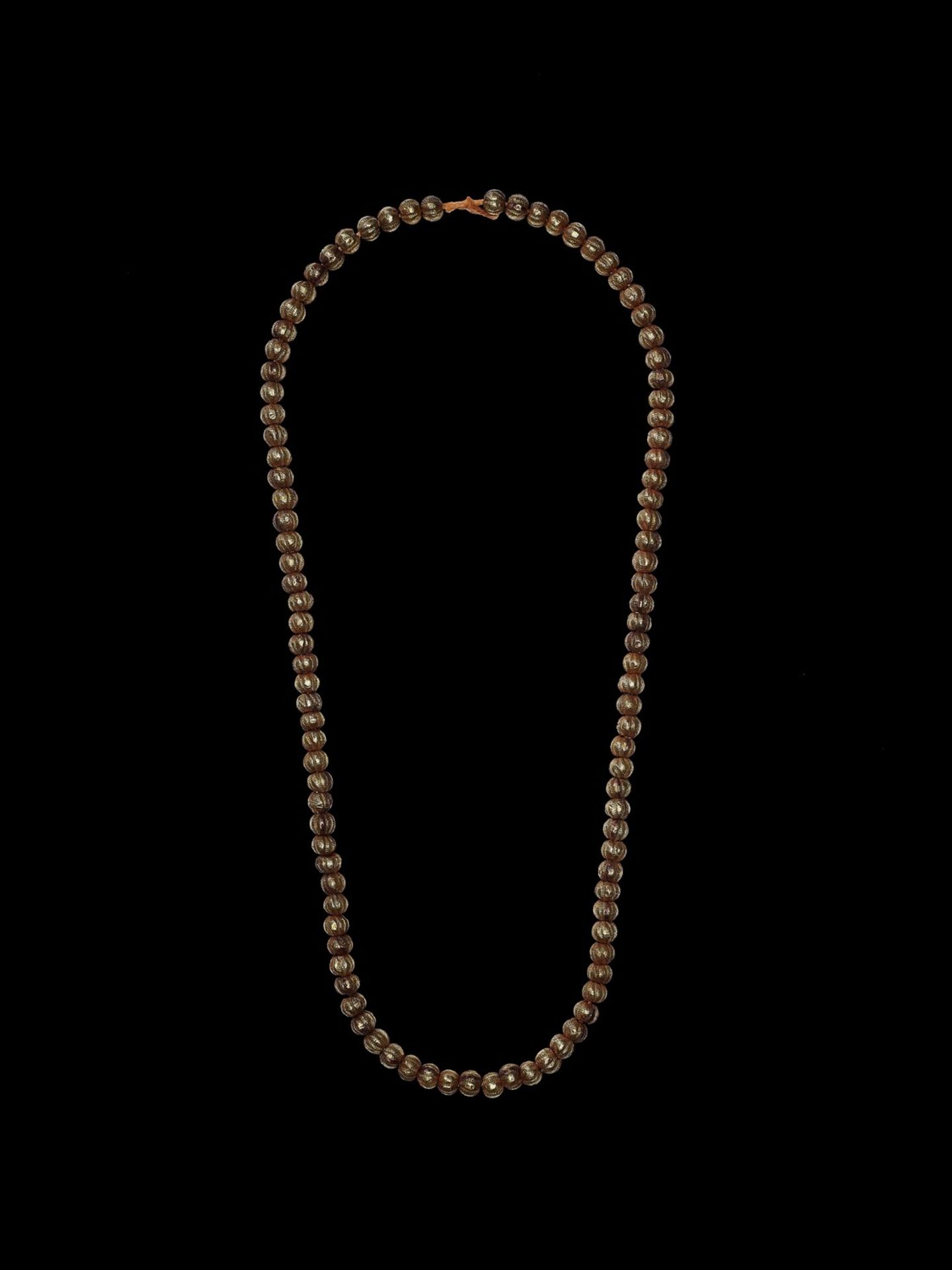 A BURMESE NECKLACE WITH 100 GILT DRY LACQUER BEADS