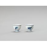 A SMALL PAIR OF BLUE AND WHITE PORCELAIN CUPS