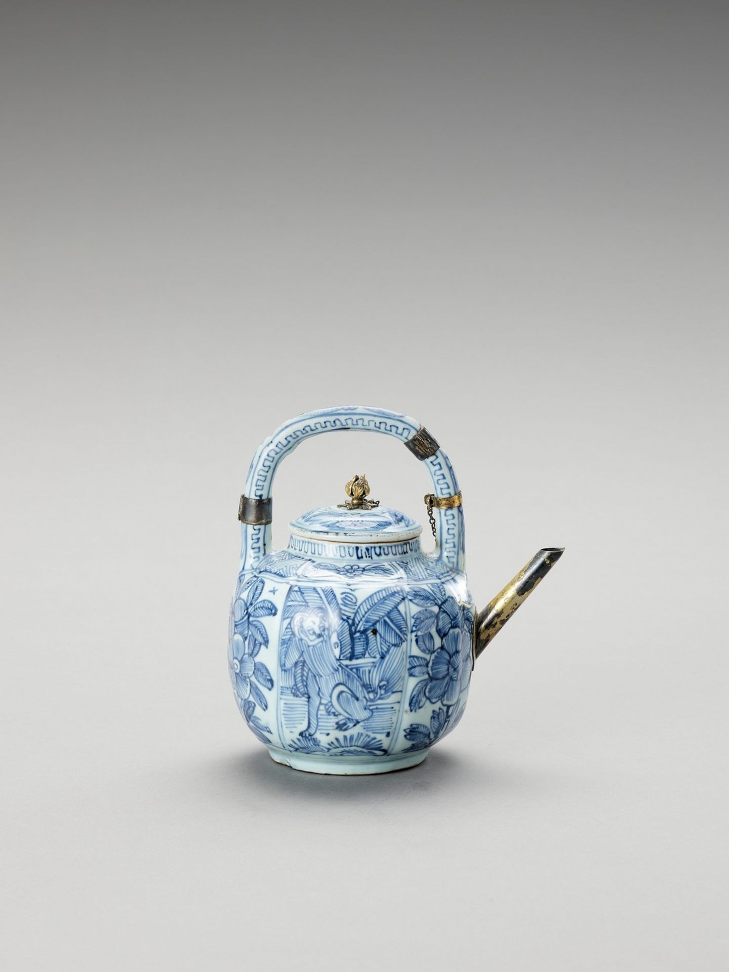 A SILVER-MOUNTED BLUE AND WHITE PORCELAIN TEAPOT