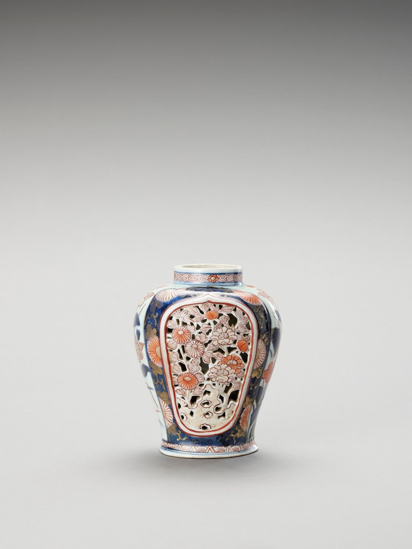 AN OPENWORK IMARI PORCELAIN VASE