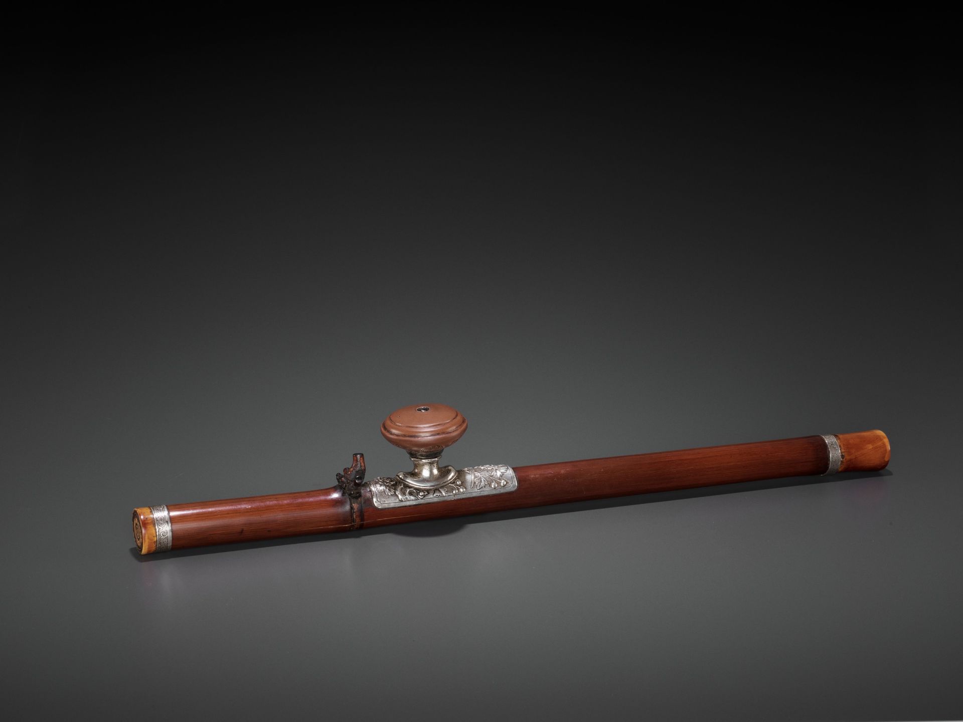 A BAMBOO OPIUM PIPE WITH IVORY, SILVER AND YIXING CERAMIC FITTINGS, LATE QING TO REPUBLIC