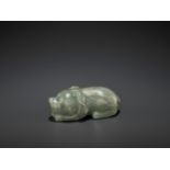 A CARVED CELADON AND RUSSET JADE FIGURE OF A DOG, LATE MING DYNASTY