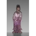 A CARVED AMETHYST FIGURE OF GUANYIN, QIANLONG MARK AND OF THE PERIOD