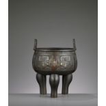 A PARCEL-GILT ARCHAISTIC BRONZE TRIPOD CENSER, MING