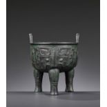 AN ARCHAIC BRONZE RITUAL FOOD VESSEL, LI DING, POSSIBLY SHANG DYNASTY