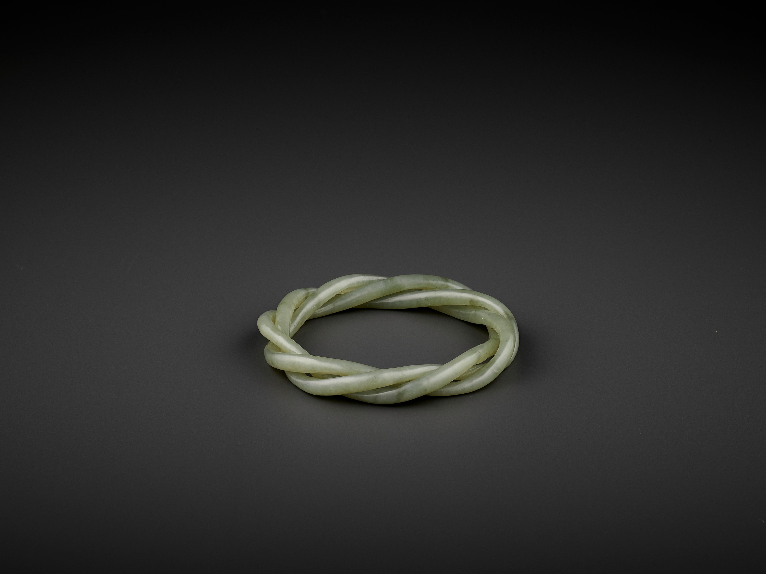 A CELADON JADE ROPE-TWIST BANGLE, QING - Image 8 of 8