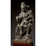 A HIGHLY IMPORTANT AND LARGE SCHIST STATUE OF HARITI, GANDHARA, 2ND-3RD CENTURY