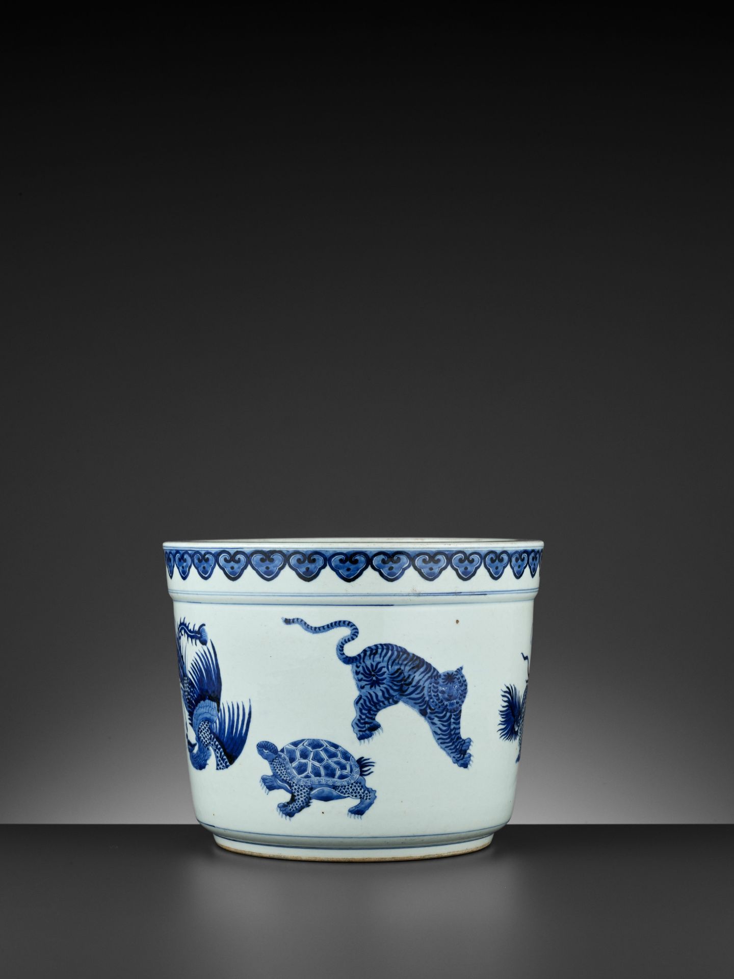 A MASSIVE BLUE AND WHITE 'FIVE MYTHICAL BEASTS' JARDINIERE, QING DYNASTY - Image 10 of 12