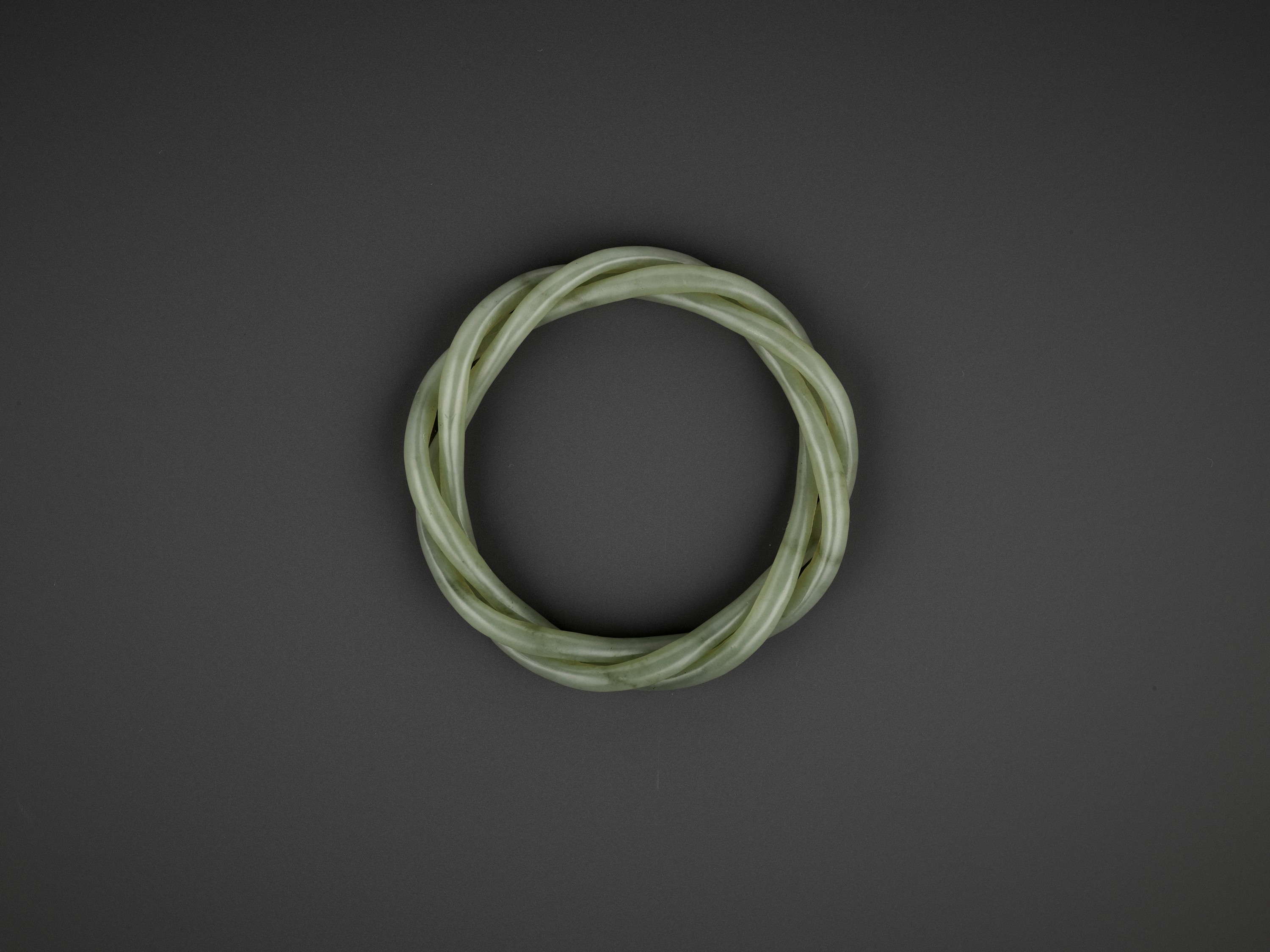 A CELADON JADE ROPE-TWIST BANGLE, QING