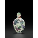 A MOLDED AND ENAMELED PORCELAIN 'MYTHICAL BEASTS' SNUFF BOTTLE, QING DYNASTY