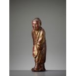 A GILT AND LACQUERED WOOD FIGURE OF A BUDDHIST PRIEST, LATE MING
