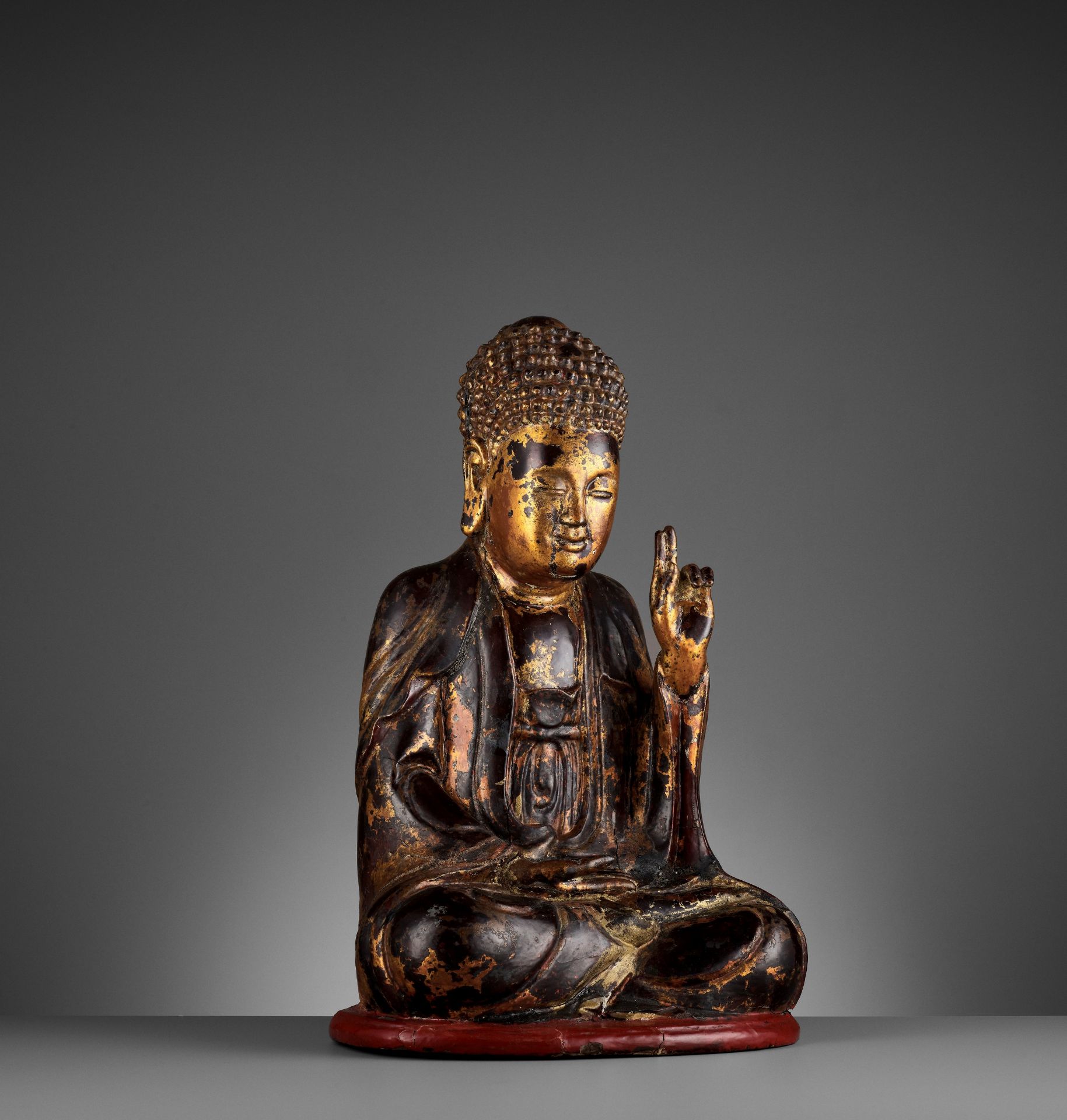 A VIETNAMESE GILT-LACQUERED WOOD STATUE OF BUDDHA
