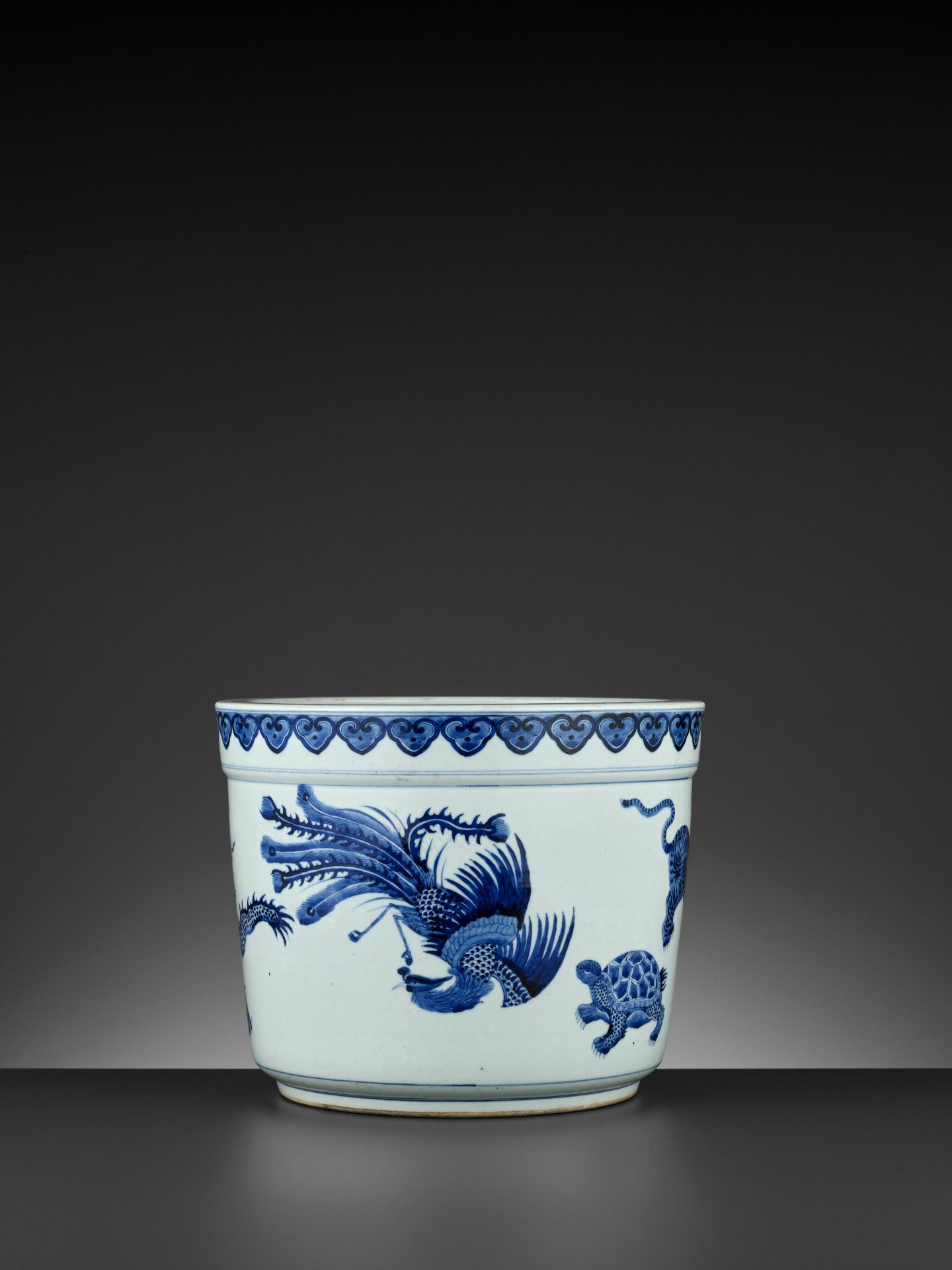A MASSIVE BLUE AND WHITE 'FIVE MYTHICAL BEASTS' JARDINIERE, QING DYNASTY - Image 9 of 12