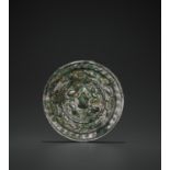 A RARE SILVERED BRONZE 'LIONS AND GRAPEVINES' MIRROR, TANG