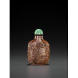 A RUSSET JADE SNUFF BOTTLE, 'MASTER OF THE ROCKS' SCHOOL, QING DYNASTY