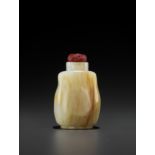 A WHITE AND RUSSET JADE SNUFF BOTTLE, QING DYNASTY