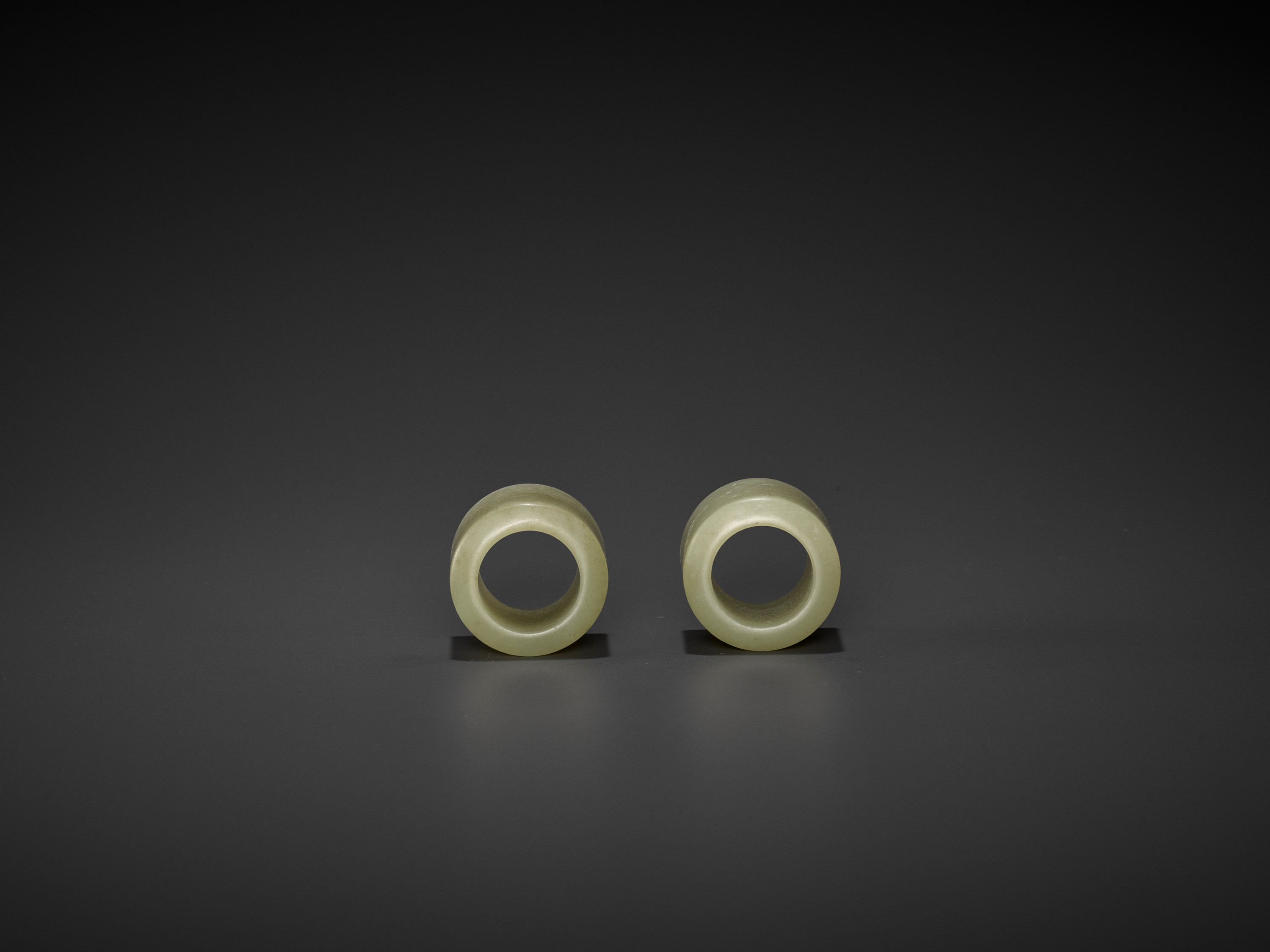 A PAIR OF CELADON JADE ARCHER'S RINGS, QING DYNASTY - Image 3 of 9