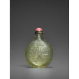 A TRANSPARENT OLIVE-GREEN GLASS 'TAOTIE' SNUFF BOTTLE, QING DYNASTY