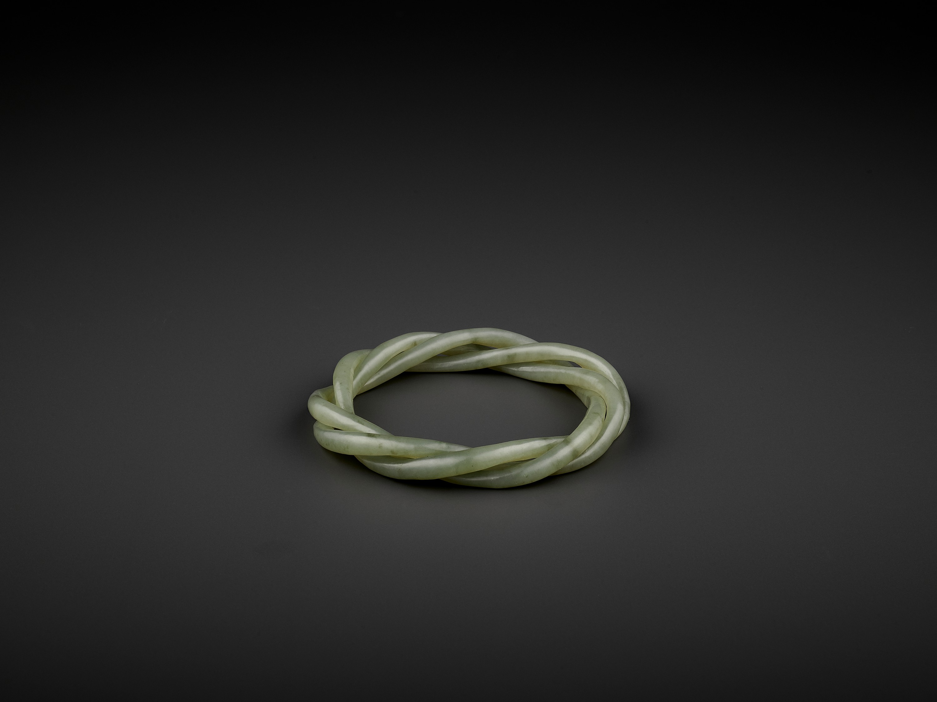 A CELADON JADE ROPE-TWIST BANGLE, QING - Image 6 of 8