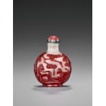 A RUBY-RED OVERLAY SNOWFLAKE GLASS 'HORSES AND PINE' SNUFF BOTTLE, QING DYNASTY