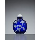A WHITE OVERLAY SAPPHIRE-BLUE GLASS 'FLORAL' SNUFF BOTTLE, QING DYNASTY
