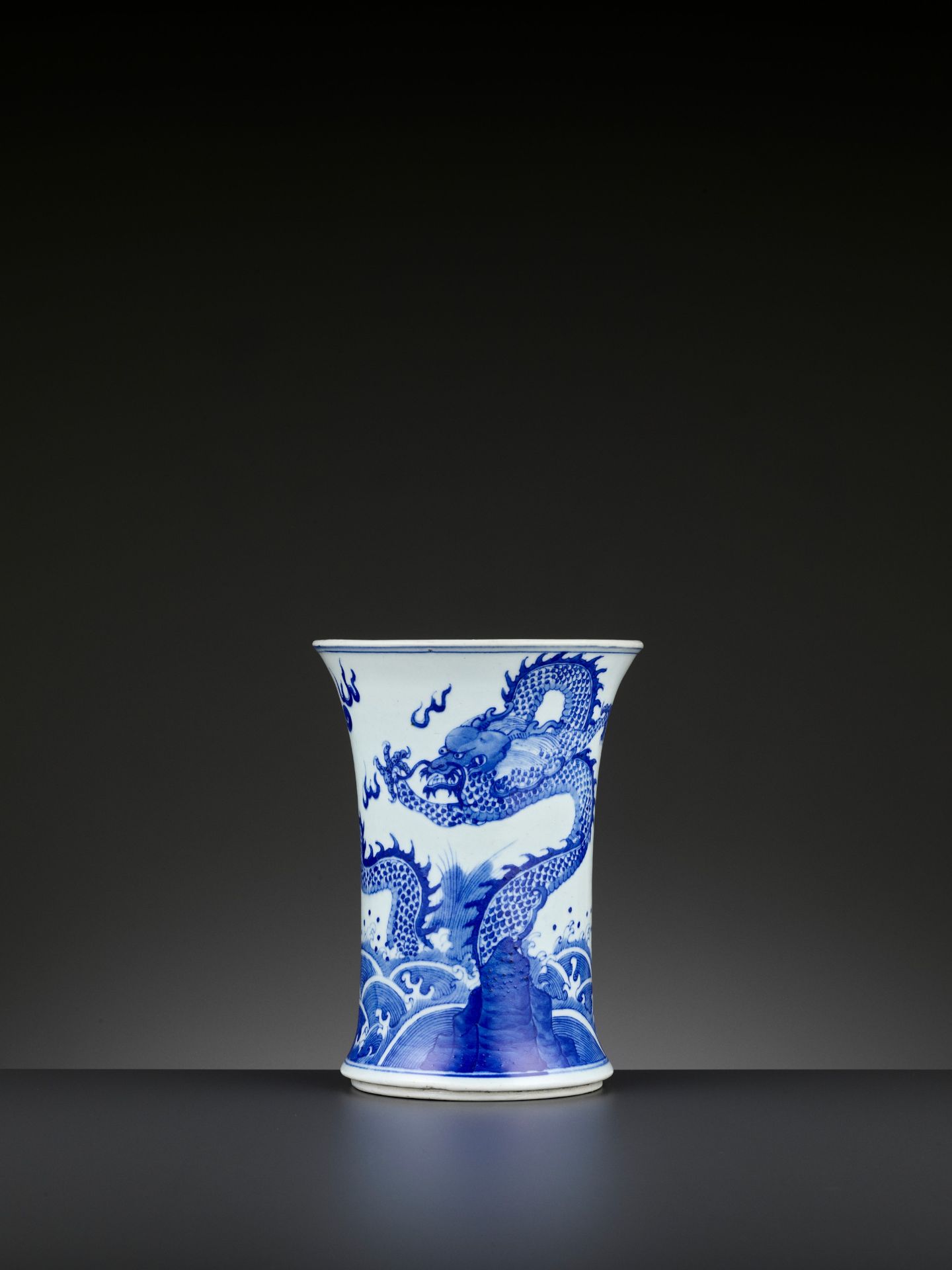A BLUE AND WHITE 'DRAGON AND GIANT CARP' BRUSH POT, BITONG, QING DYNASTY