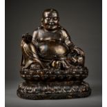 AN EXCEPTIONALLY LARGE AND MASSIVE CAST-BRONZE AND COPPER-REPOUSSE STATUE OF BUDAI, QING DYNASTY