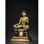A HEAVY GILT BRONZE ‘KASHMIR REVIVAL’ FIGURE OF BUDDHA SHAKYAMUNI, LATER 18TH- EARLIER 20TH CENTURY