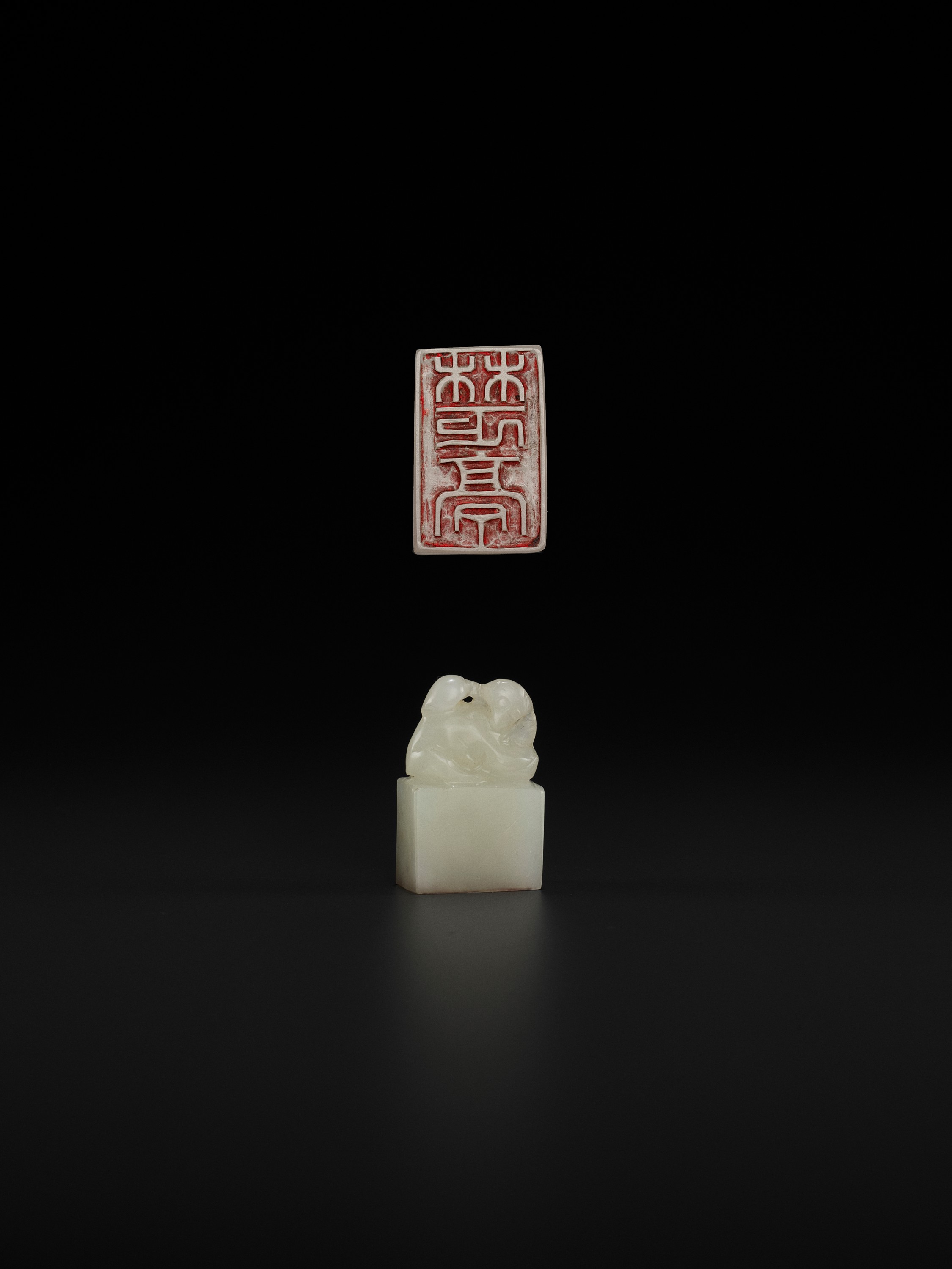 A WHITE JADE 'MONKEY AND PEACH' SEAL, MID-QING TO REPUBLIC