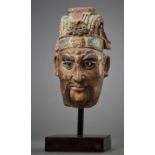 A LARGE PAINTED STUCCO HEAD OF A GUARDIAN KING, SONG TO MING DYNASTY