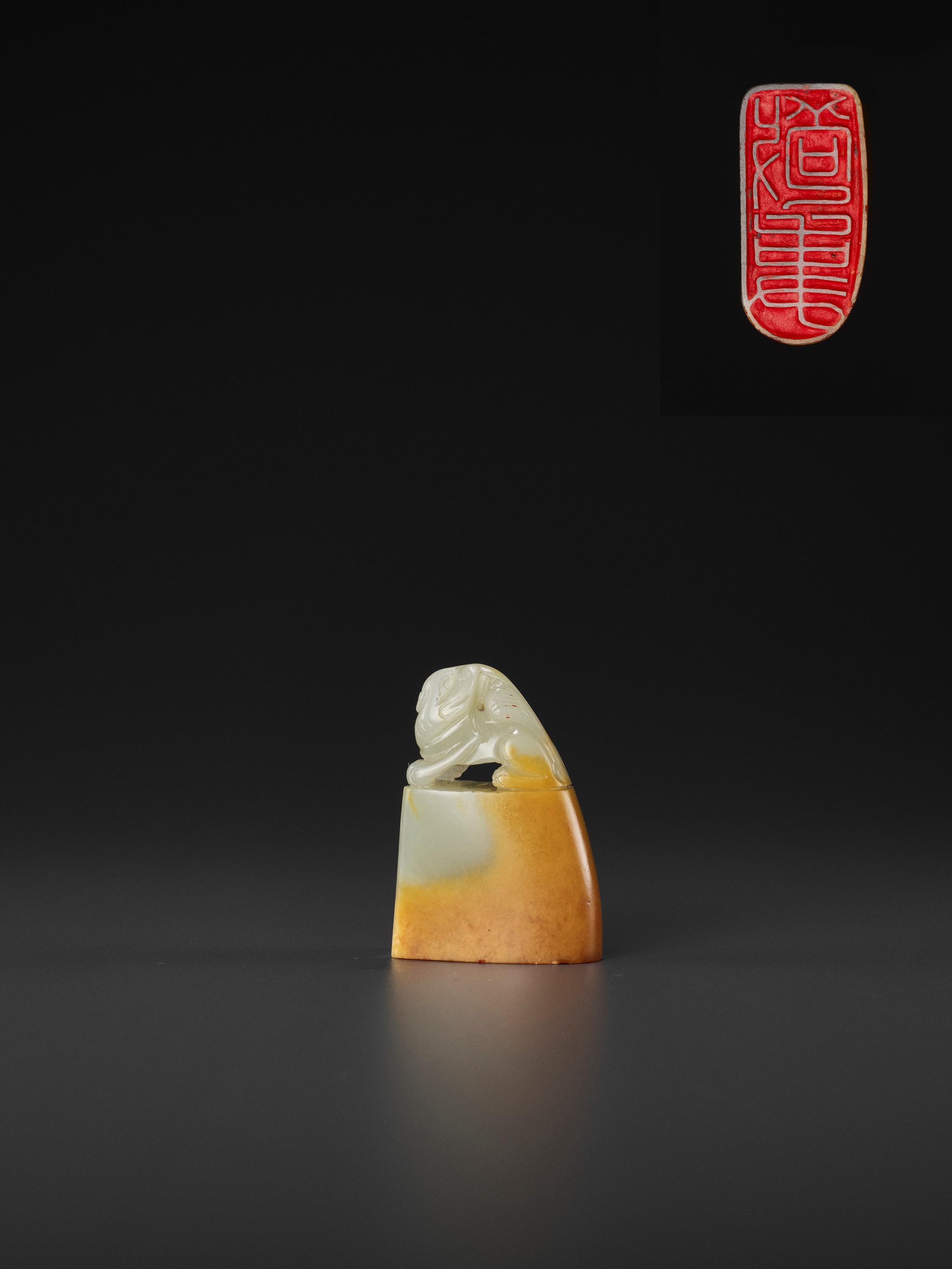 A PALE CELADON AND AMBER JADE 'BUDDHIST LION' SEAL, MID-QING TO REPUBLIC