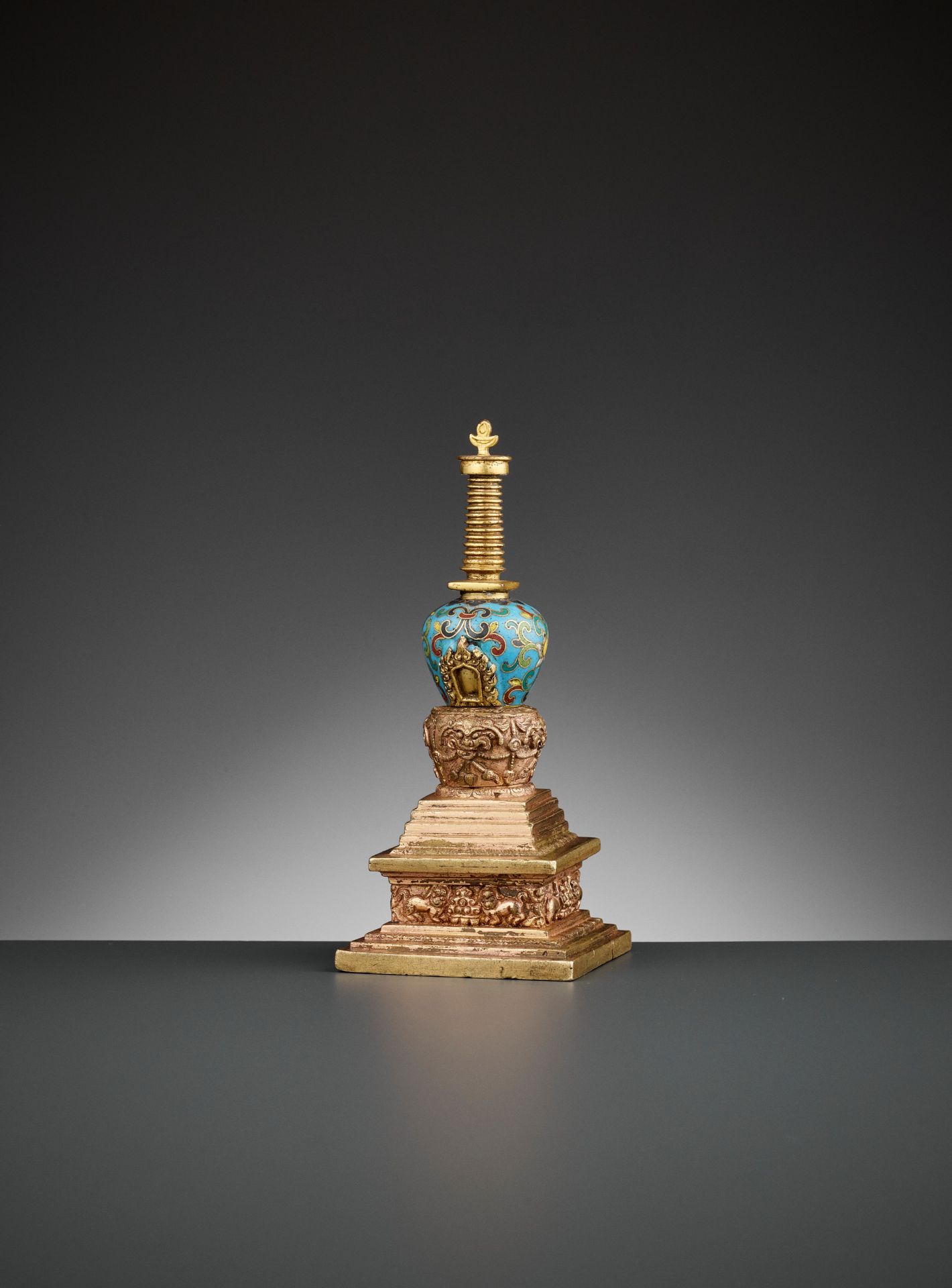 A GILT-BRONZE AND CLOISONNE ENAMEL STUPA, QIANLONG