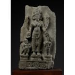 AN IMPORTANT STONE STELE OF PARVATI WITH HER SONS GANESHA AND SKANDA