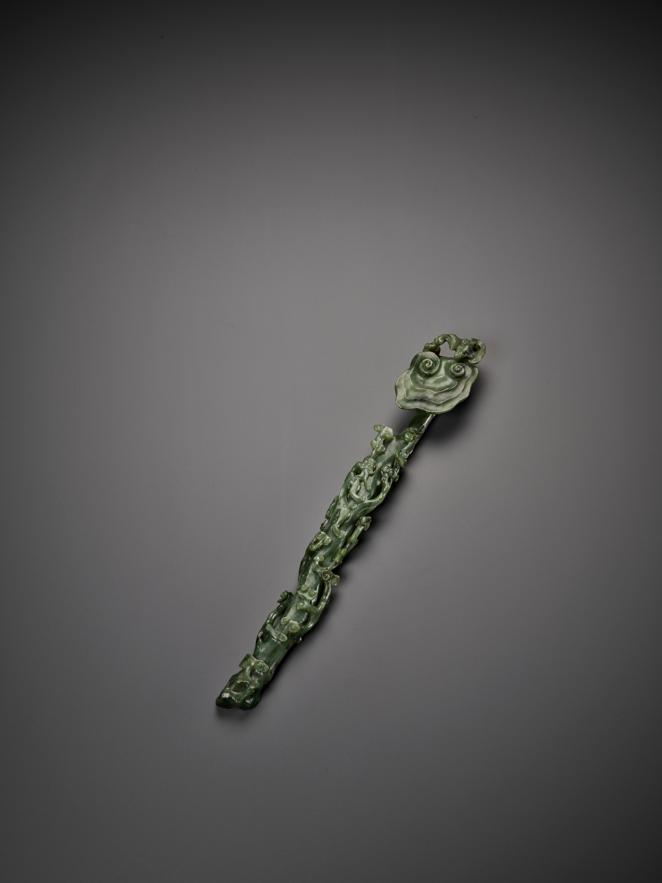 A SPINACH-GREEN JADE RUYI SCEPTER, MID-QING - Image 10 of 15