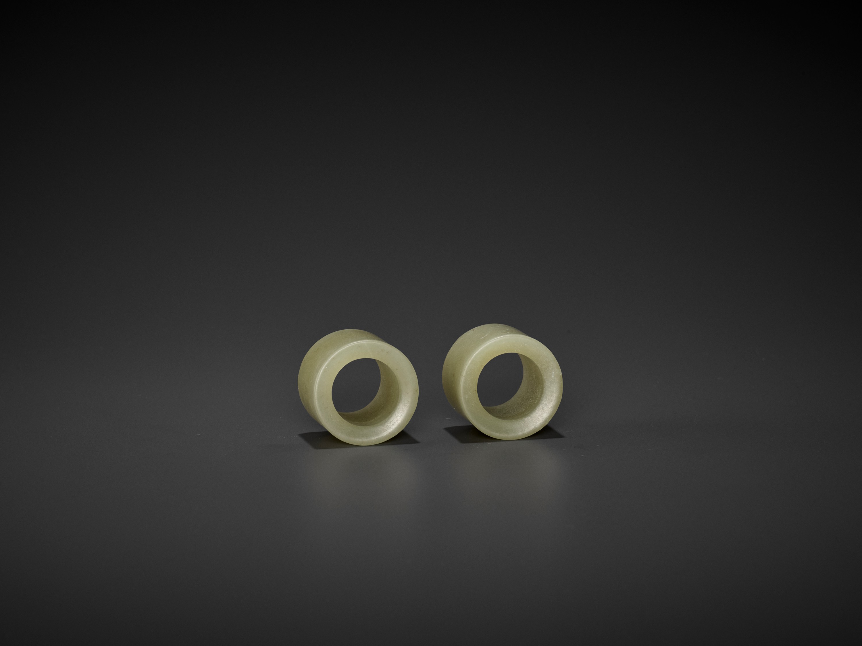 A PAIR OF CELADON JADE ARCHER'S RINGS, QING DYNASTY - Image 5 of 9