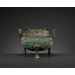 AN ARCHAIC BRONZE RITUAL TRIPOD VESSEL AND COVER, DING, EASTERN ZHOU