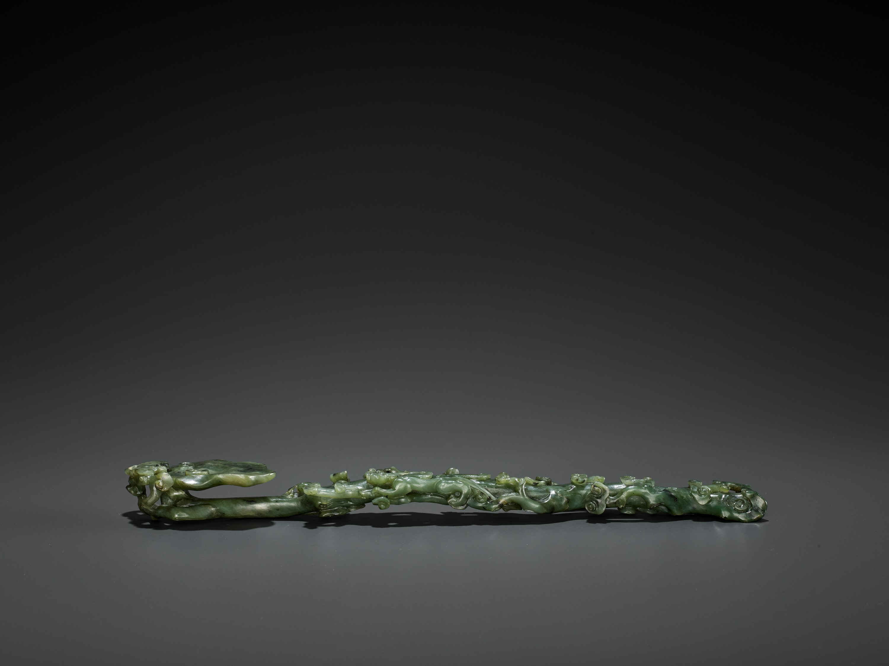 A SPINACH-GREEN JADE RUYI SCEPTER, MID-QING - Image 6 of 15