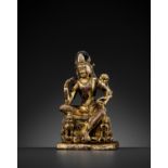 A RARE GILT-COPPER FIGURE OF PADMAPANI, NEPAL, LICCHAVI OR TRANSITIONAL PERIOD